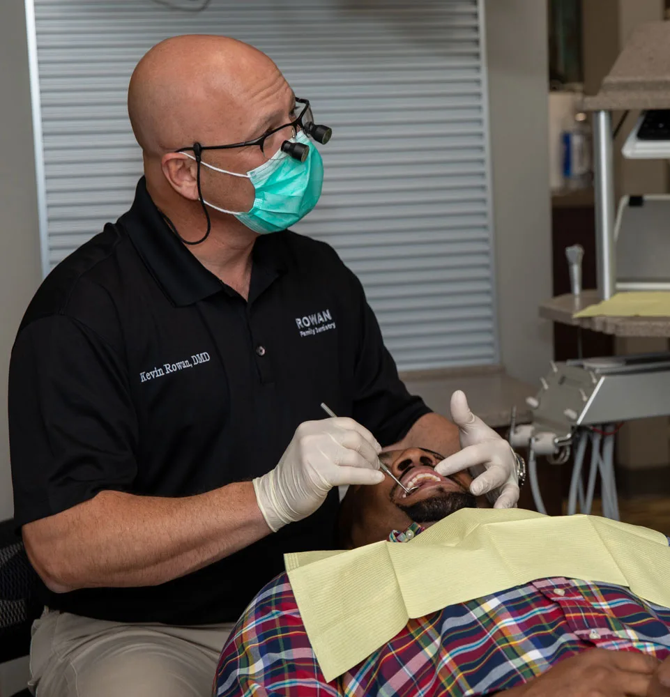 dr rowan performing orthodontics procedure